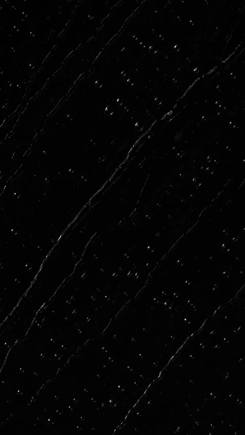 Vertical water rainfall, rain drops falling on window glass on black background Stock Footage 286296348