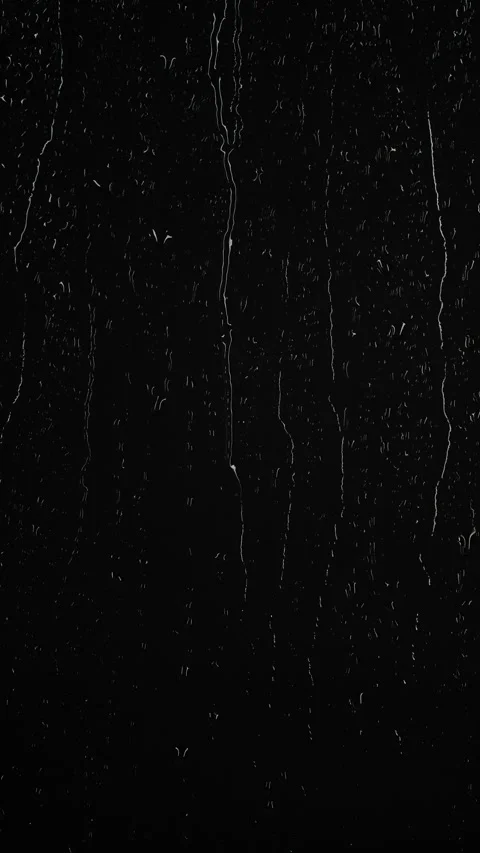 Vertical water rainfall, rain drops falling on window glass on black background Stock Footage 289603026