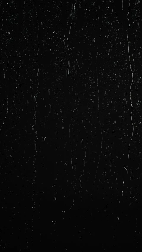 Vertical water rainfall, rain drops falling on window glass on black background Stock Footage 295096698
