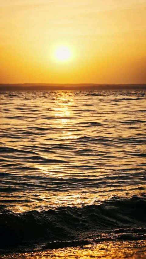 Vertical Water Surface at Sunset in Slow Motion Stock Footage 253381243