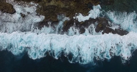 Vertical of Waves Breaking on rocky shore line Video stock 92843468