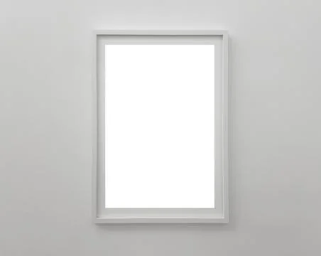 Vertical white frame on a light wall with empty space for artwork, poster, .. Stock Photos