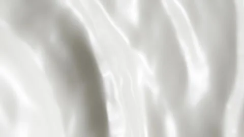 Vertical white liquid cream ripples, close-up fresh milk drink splash texture Stock Footage 250587747