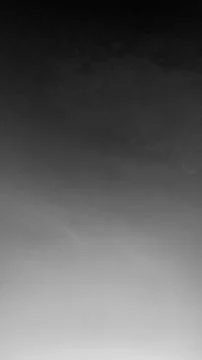 A vertical wide angle long exposure perspective captures a dark clear night.. Stock Photos