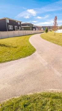 Vertical Wide angle view of a fork in a pedestrian walkway Stock Photos