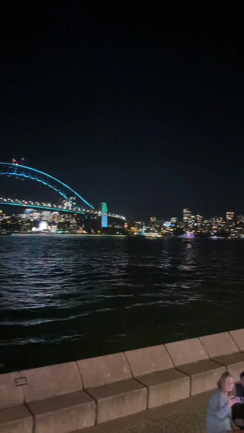 Vertical Wide Night Shot of Sydney Opera House Illuminated with Colorful Light Stock Footage 346176529