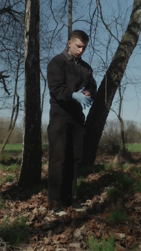Vertical wide shot of man putting on gloves for volunteering Stock Footage 333118449