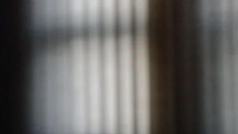 Vertical window venetian blind open being slowly opened and quickly closed Stock Footage 114129279