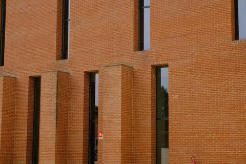 Vertical windows on a brick wall. Stock Photos