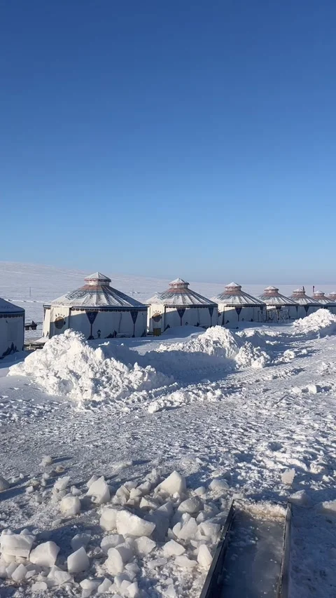 Vertical Winter Nomadic Life with Traditional Yurts and Horse Tracks in Snow Video stock 332525612
