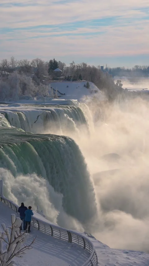 Vertical Winter View Of American Falls With Ice Mound And Rising Mist Stock-Footage 342331510