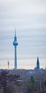 Vertical Winter View of Berlin TV Tower and Church Spire 스톡 사진