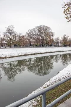 Vertical Winter View of Nitra River and Snowy Embankment Stock Photos