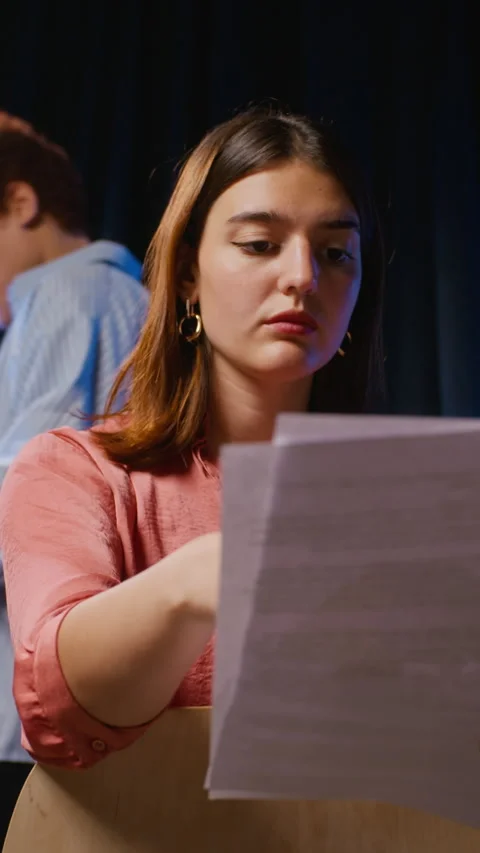 Vertical of Woman Practicing Acting Lines with Script during Theater Rehearsal Stock Footage 344534447