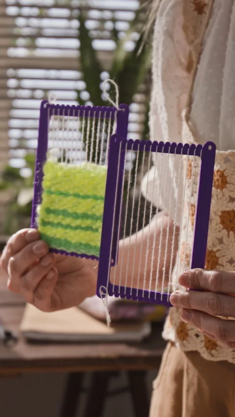 Vertical of Woman Presenting Small Hand Looms for Weaving Craft Project Stock Footage 341939810