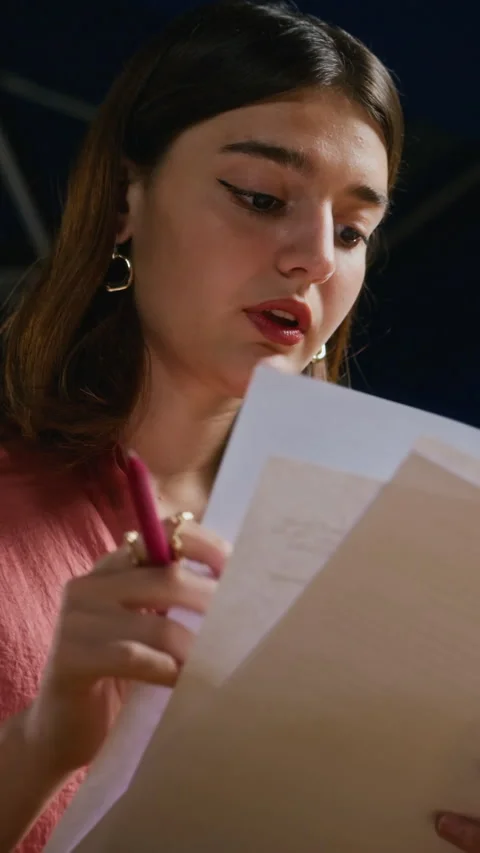 Vertical of Woman Reading Script with Pen during Theater Rehearsal Stock-Footage 344534692
