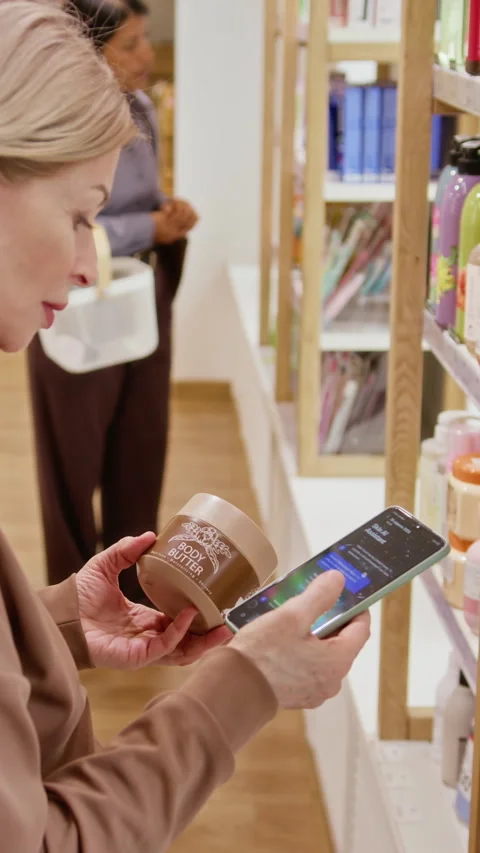Vertical of Woman Using Ai Assistant on Smartphone While Shopping for Cosmetics Stock Footage 345511692