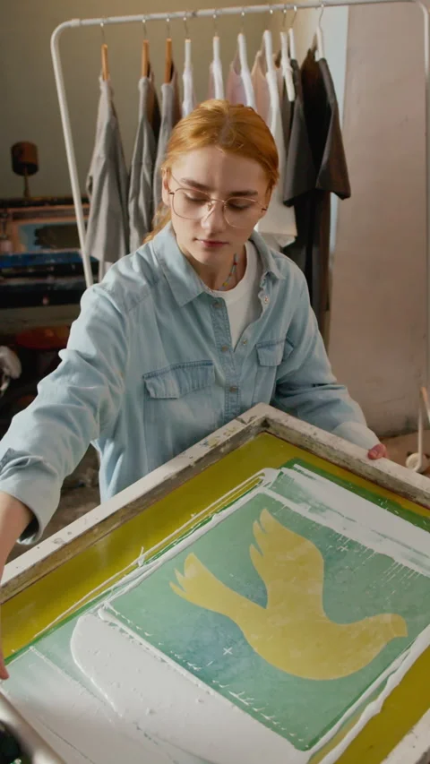 Vertical of Woman Using Squeegee on Printing Screen in Studio Stock-Footage 333159234