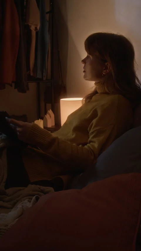 Vertical of Woman Using Tablet Computer for Online Shopping at Home at Night Stock Footage 341675157