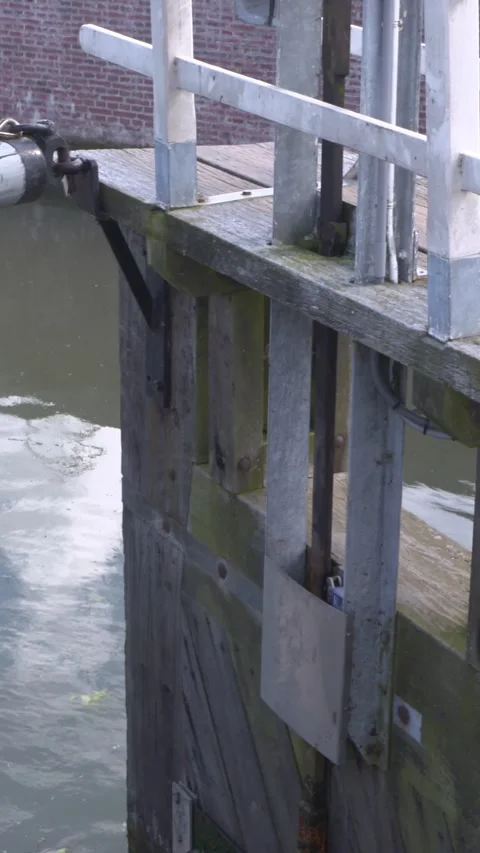 Vertical - wooden lock gate opens Stock Footage 309614527