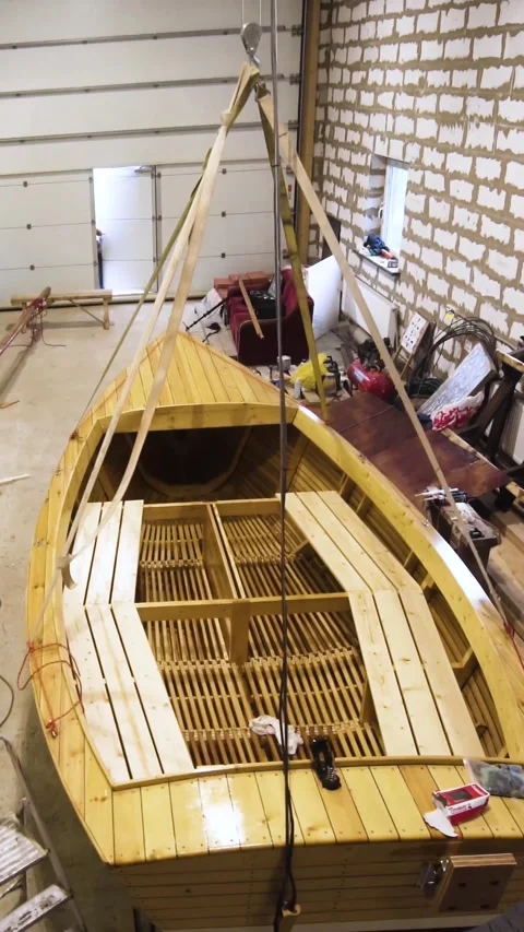 Vertical of Wooden sailboat inside workshop Stock Footage 305456985