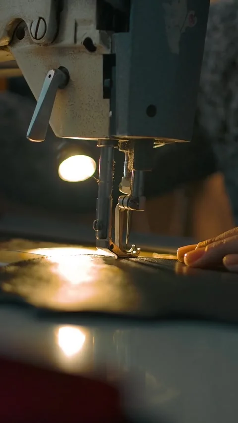 Vertical of Working sewing machine presser foot stitching Stock Footage 276928741