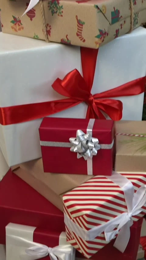 Vertical wrapped gift boxes under a Christmas decoration tree at home, Xmas Stock Footage 292301465