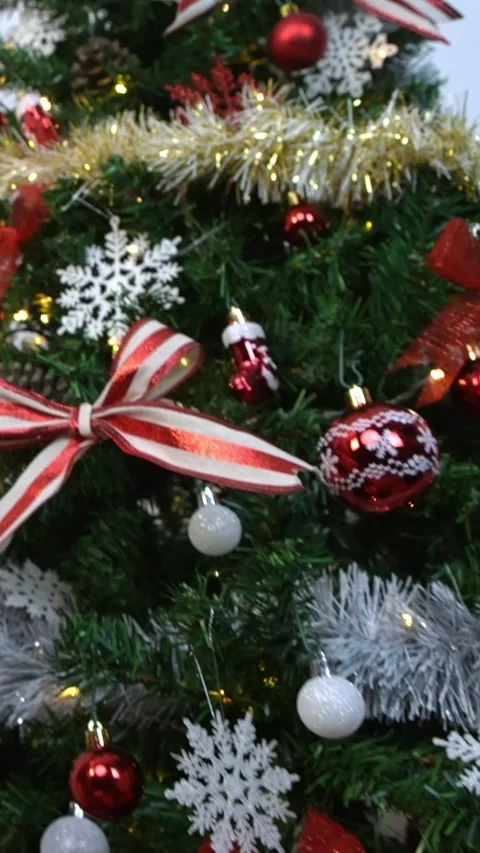 Vertical Wrapped gift boxes under a Christmas decoration tree home, Happy Xmas Stock Footage 317110562