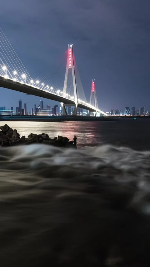 Vertical Wuhan Yangtze River Bridge Timelapse with City Traffic and Water Vista Stock Footage 327479412