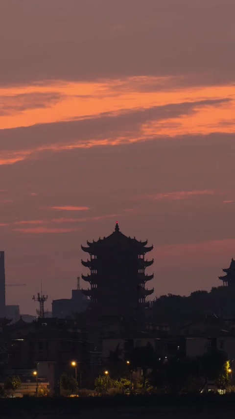 Vertical Wuhan Yellow Crane Tower Sunrise Timelapse with Golden Sun and Clouds Stock Footage 327600418