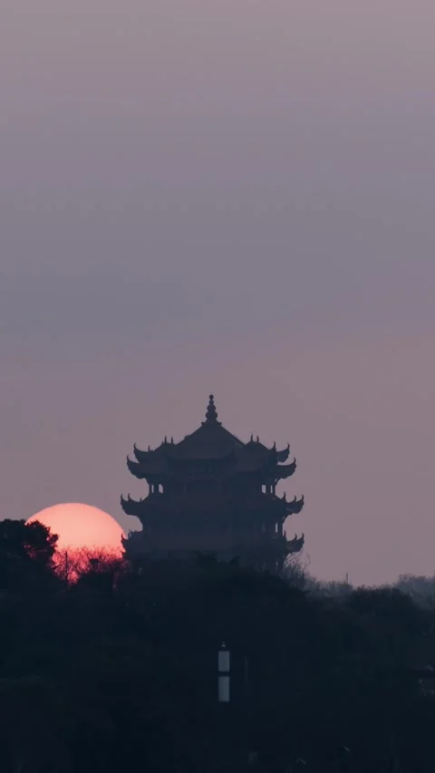 Vertical Wuhan Yellow Crane Tower Sunrise Timelapse with Golden Sun and Clouds Stock Footage 327600524