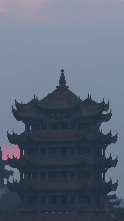 Vertical Wuhan Yellow Crane Tower Sunrise Timelapse with Golden Sun and Clouds Stock Footage 327600571