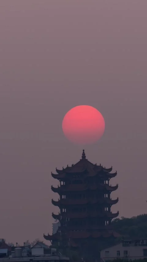 Vertical Wuhan Yellow Crane Tower Sunrise Timelapse with Golden Sun and Clouds Stock Footage 327600572