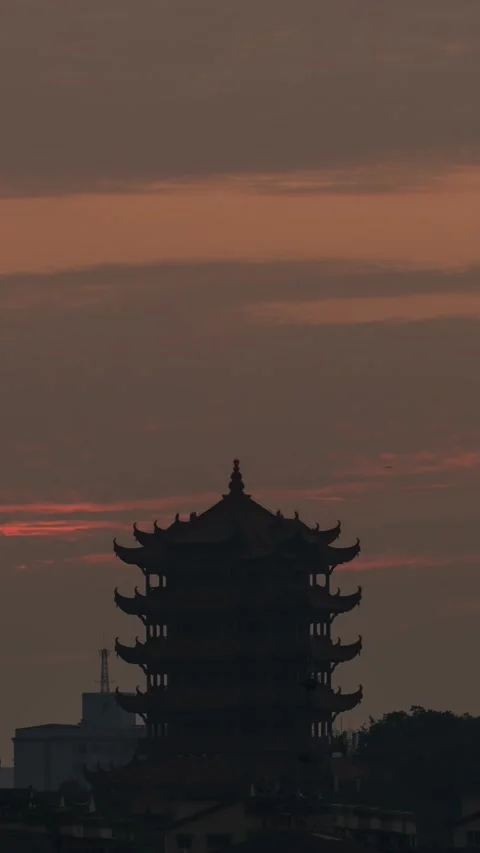 Vertical Wuhan Yellow Crane Tower Sunrise Timelapse with Golden Sun and Clouds Stock Footage 327600671