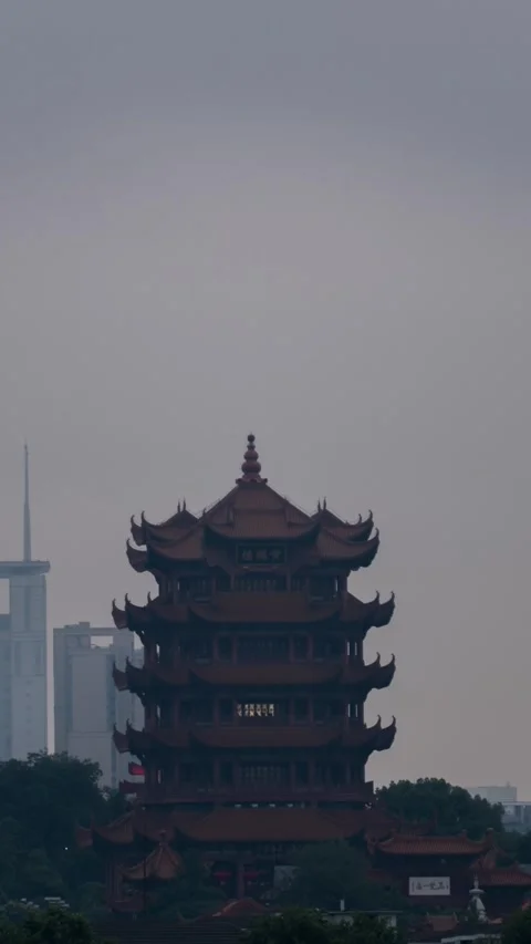 Vertical Wuhan Yellow Crane Tower Day to Night Timelapse with City Lights Glow Stock Footage 327600852