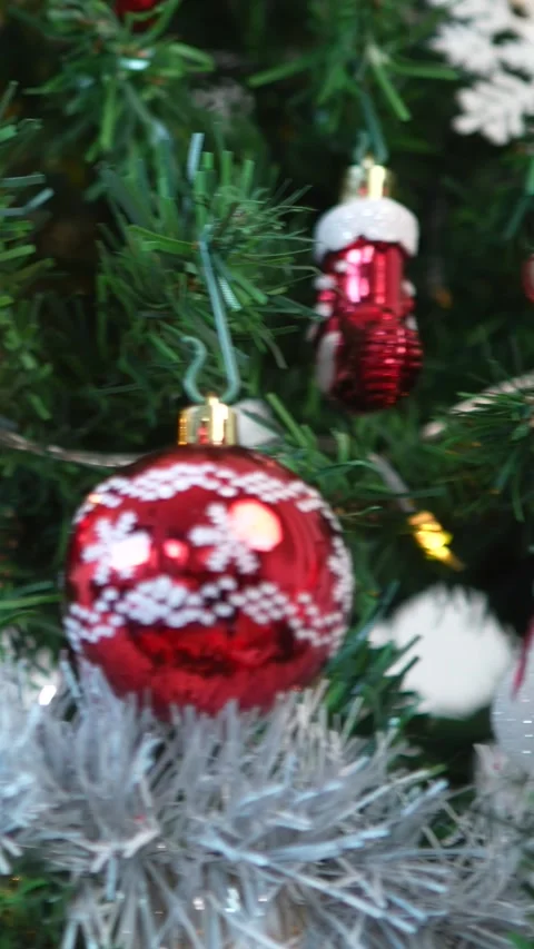 Vertical Xmas red and white bow decoration adorns the tree with Christmas balls Stock Footage 315237318