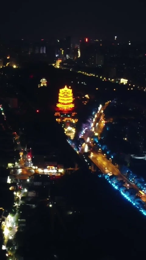 Vertical Yellow Crane Tower Night Aerial Drone Cityscape Motion Stock Footage 327678772