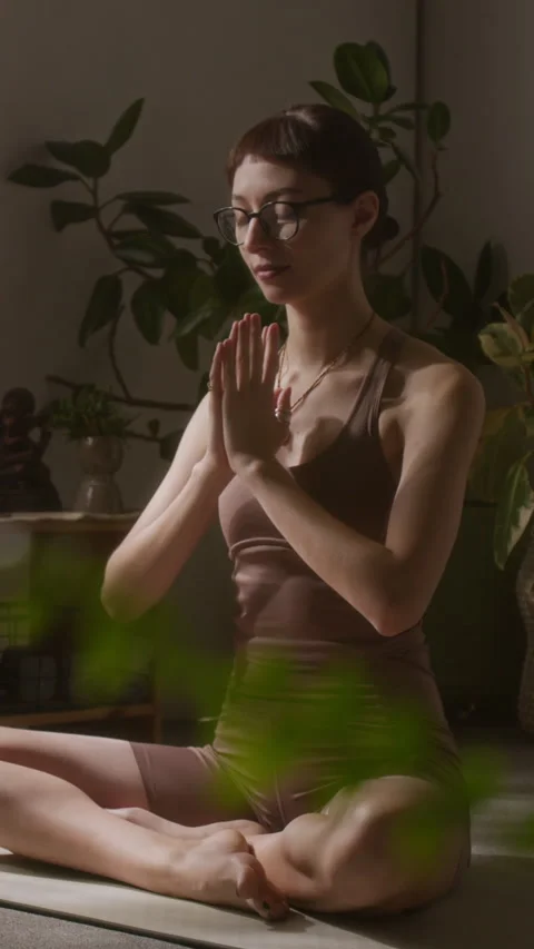 Vertical of Yoga Devotee Folding Hands in Namaste for Daily Meditation Stock Footage 329761064