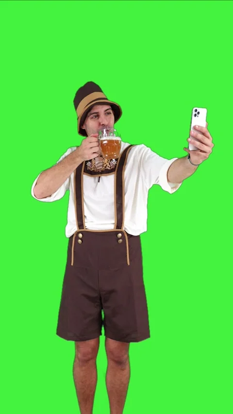 Vertical young bavarian man taking selfie with smartphone while holding bee.. Stock-Footage 281192363