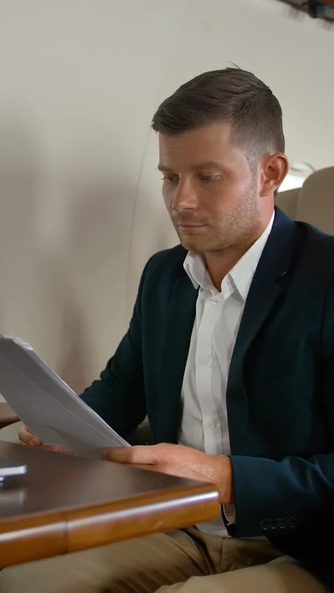 Vertical of Young entrepreneur sleeping inside of private jet cabin Stock Footage 277281096