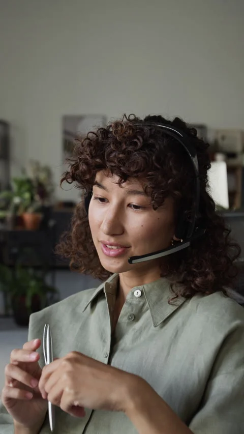 Vertical of Young Female Customer Support Agent Talking during Online Call Stock Footage 343622777