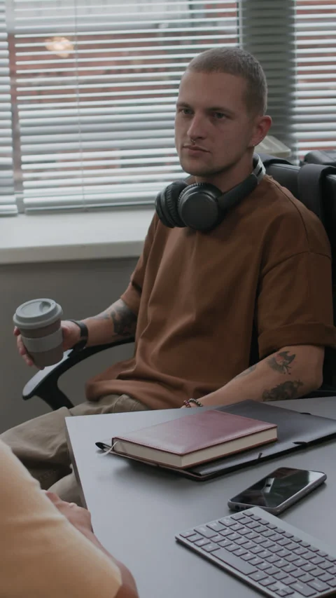 Vertical of Young Male Programmer Chatting with His Colleague in IT Office Stock-Footage 292902283