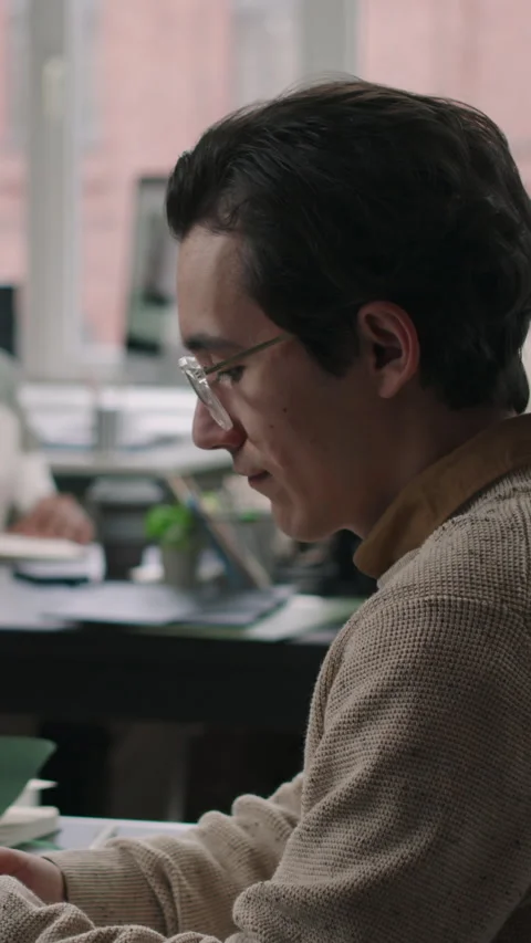 Vertical of Young Male Programmer Coding in Office Stock Footage 275028766