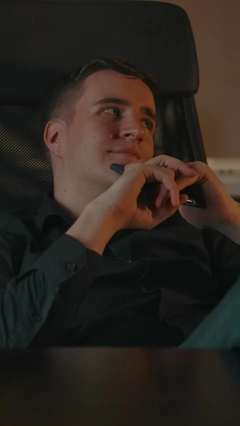 Vertical of Young man dreaming about something, between remote job paused Stock Footage 276925978