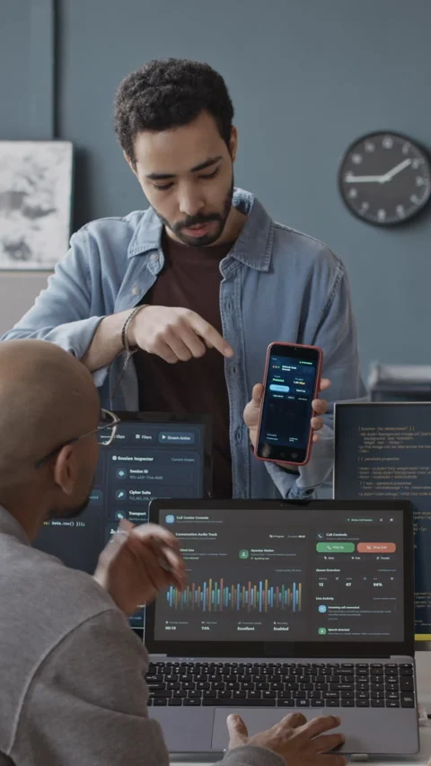 Vertical of Young Software Developers Discussing Mobile App on Smartphone 스톡 동영상 337481554