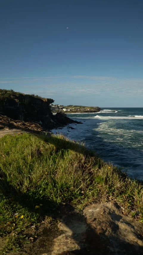 Vertical zoom helicopter over Coogee cliffs in Sydney 4K Stock Footage 310027938
