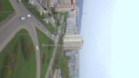 Vertically. the blurred background. traffic at an intersection in the city. Video stock 130398305