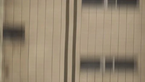 Vertically blurred wall of building in motion. Falling from a high-rise build Stock Footage 150332294