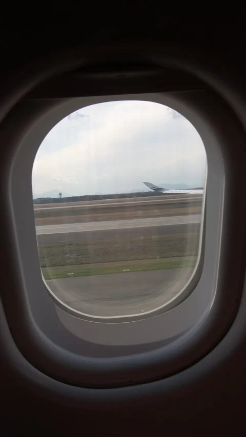 Vertically captured: Interior view of a plane taxiing on the ground. Stock Footage 307710802