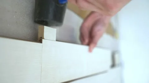 Vertically. close-up. male hands install white laminate indoors Stock-Footage 146331946